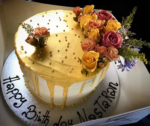 Elegant handcrafted birthday cake with delicate decorations